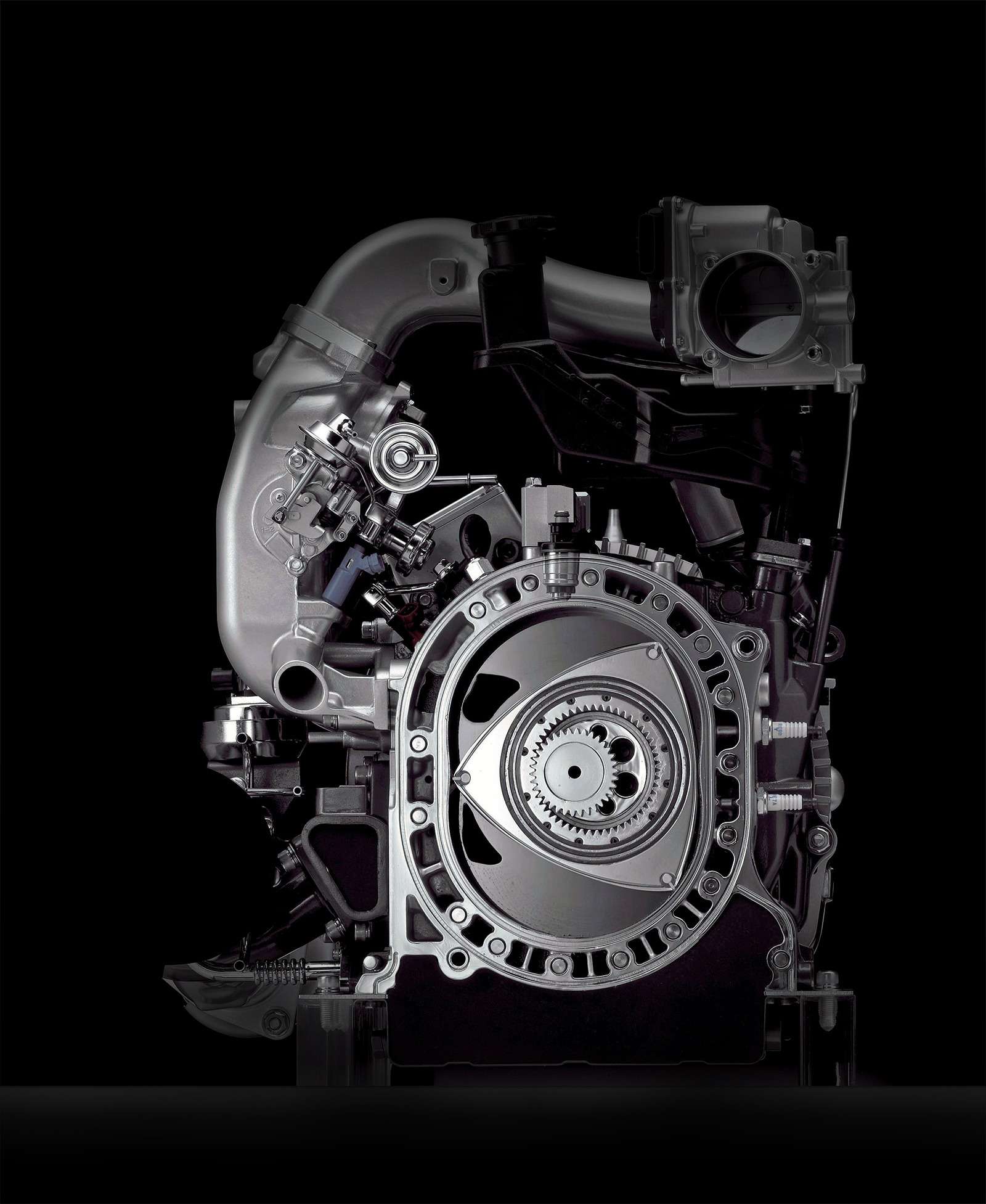 Поршневой двигатель автомобиля. Двигатель Мазда rx8. Роторный двигатель Мазда рх8. Mazda rx8 двигатель Ванкеля. Роторный мотор Мазда rx8.